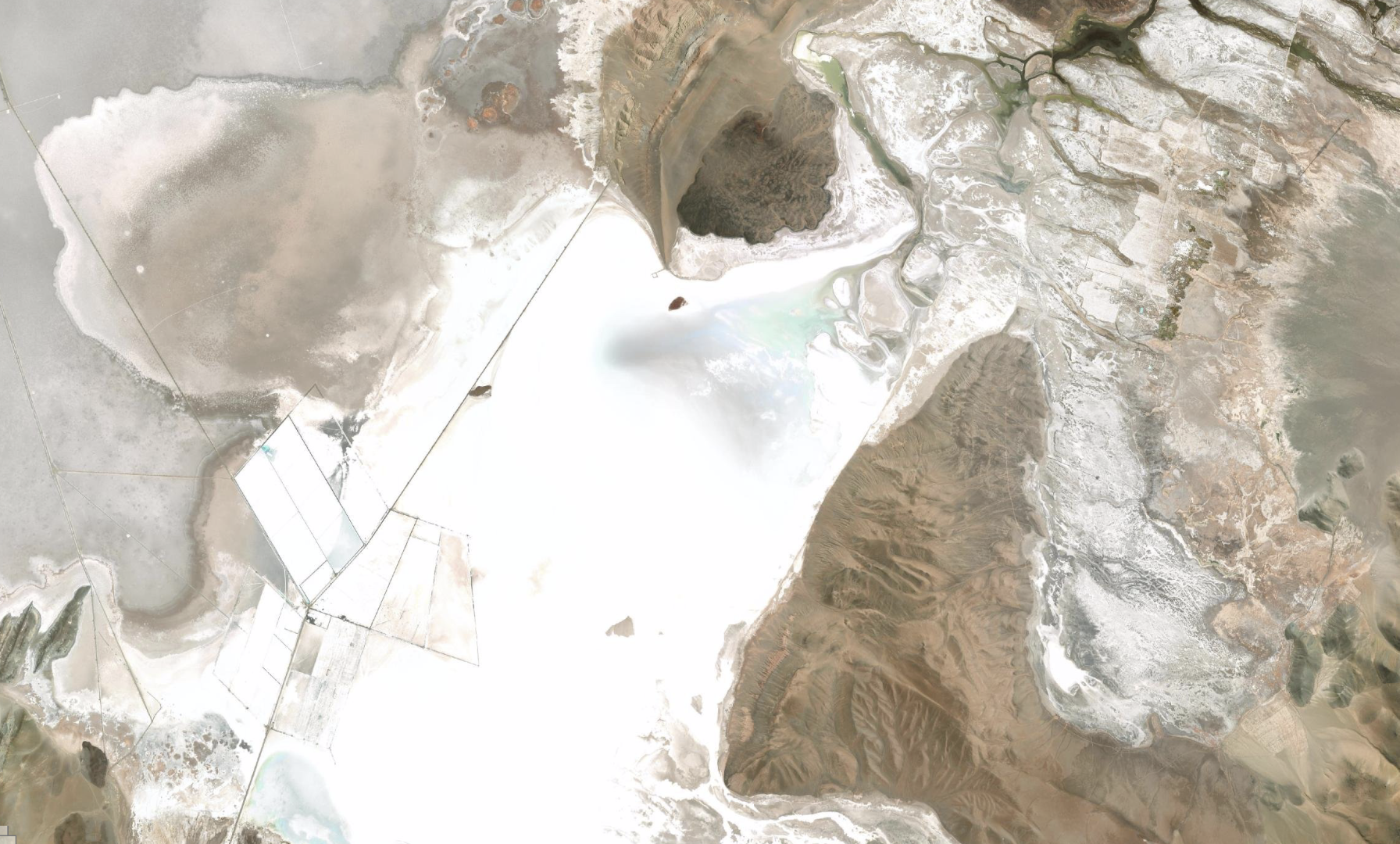 Satellite map of a salt flat with geometric evaporation ponds